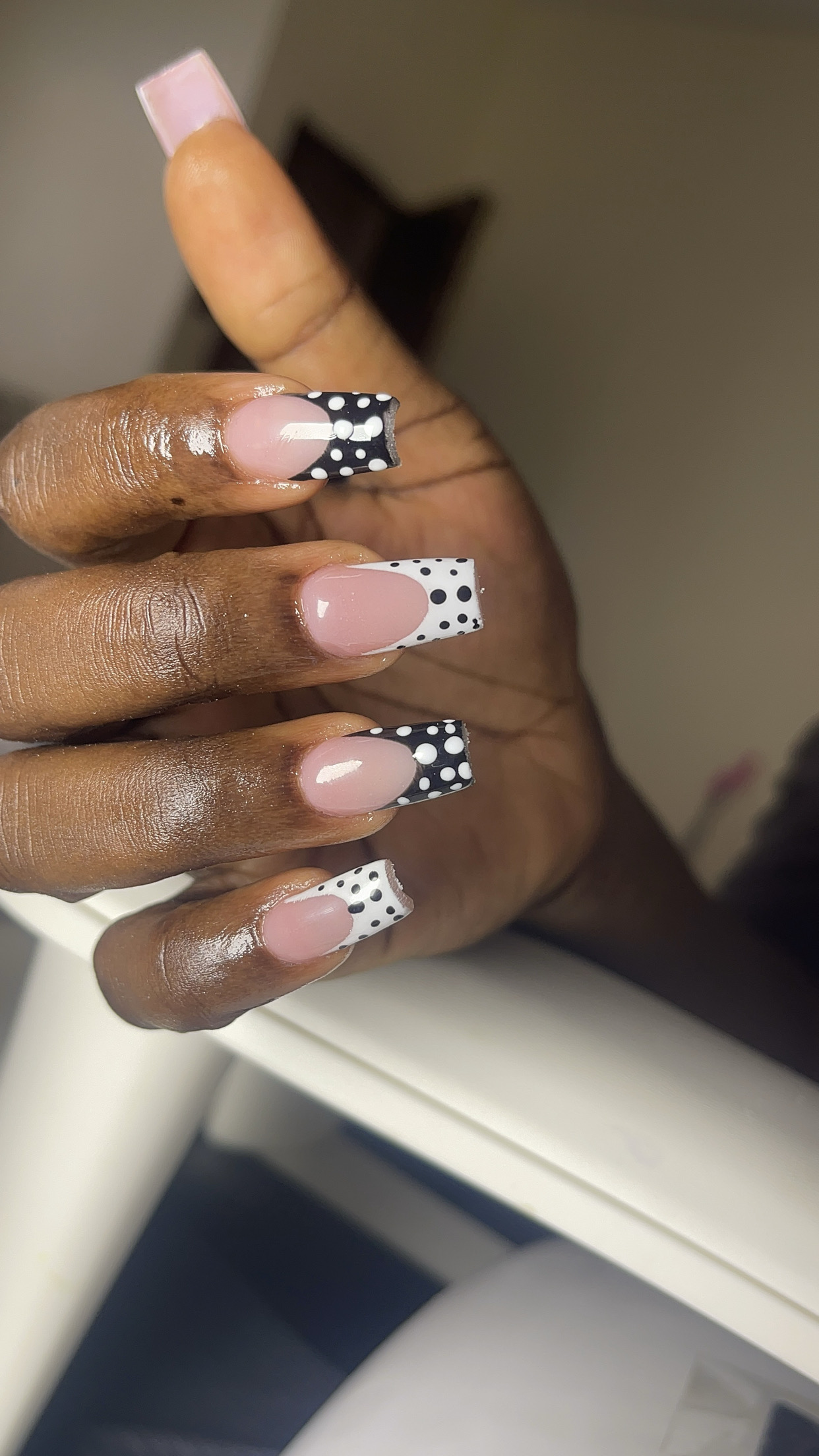 Black-and-white polka dot French tip nails — Shin Signature Sango, Ibadan