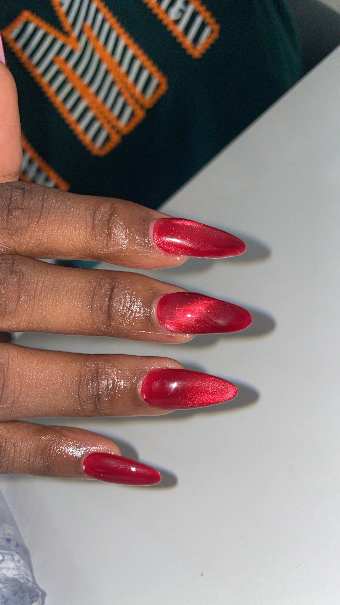 Long red stiletto acrylic set with metallic finish — Shin Signature Ibadan